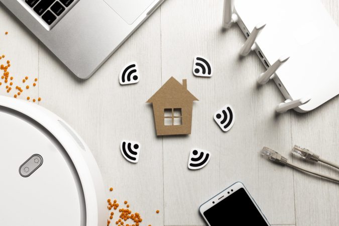 top-view-wi-fi-router-with-house-figurine-wireless-controlled-devices top-view-wi-fi-router-with-house-figurine-wireless-controlled-devices